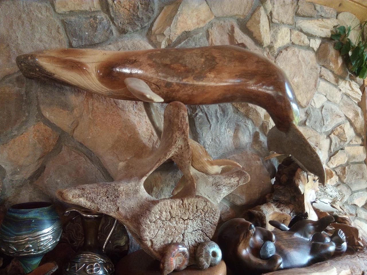 Mantle decorations. Wooden whale sculpture.