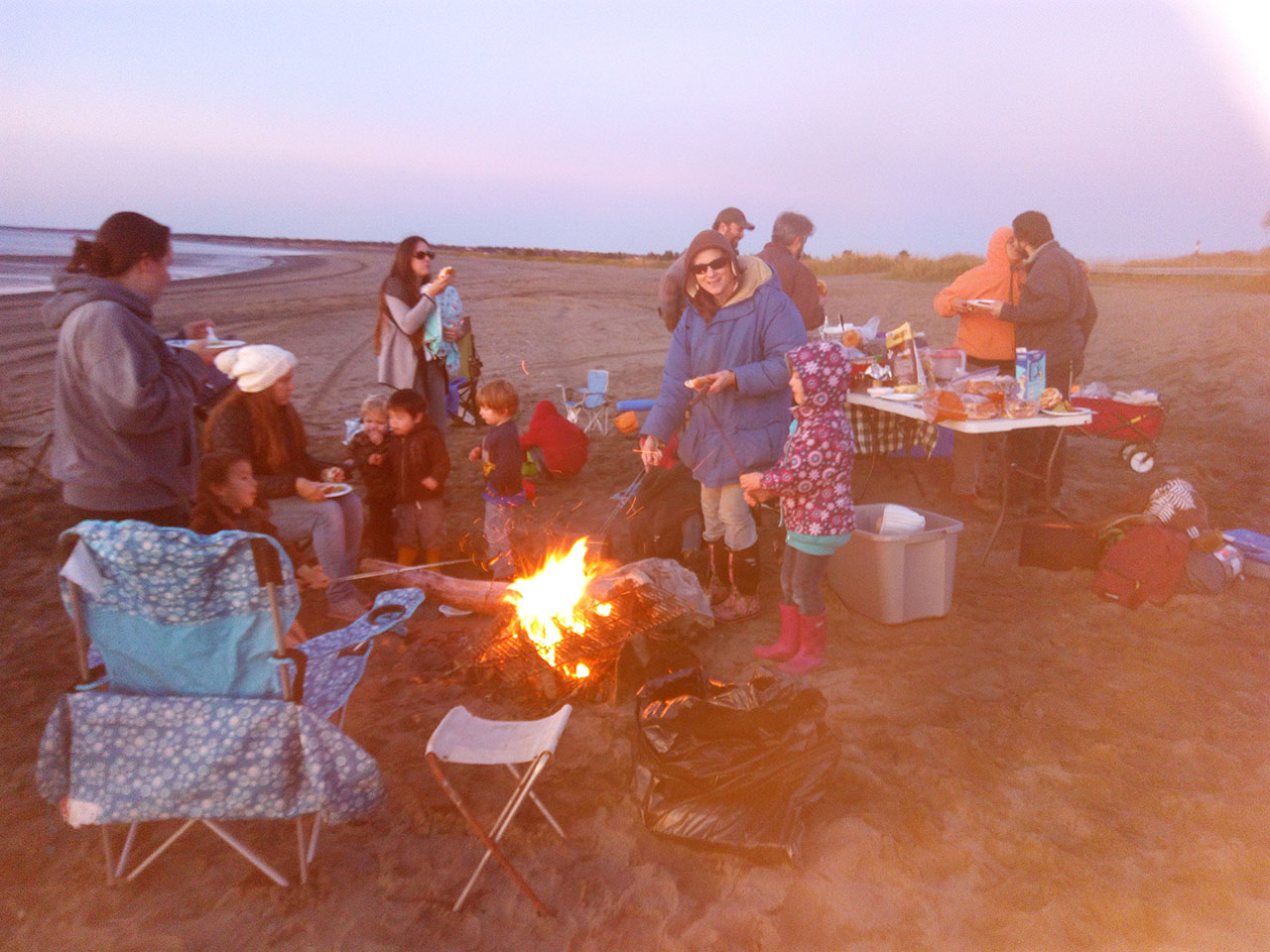 Family barbecue on the beach.